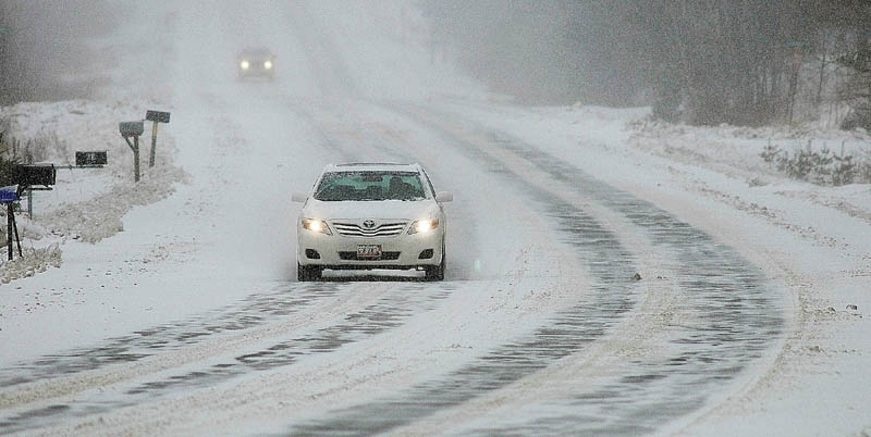 Snow falls and blows on Brunswick Avenue, U.S. Route 201, around 9 a.m. this morning in Gardiner. There was only light snow so far, but many schools were closed in anticipation of the storm worsening as the day goes on. Forecasts call for up to a foot of snow before the storm ends.