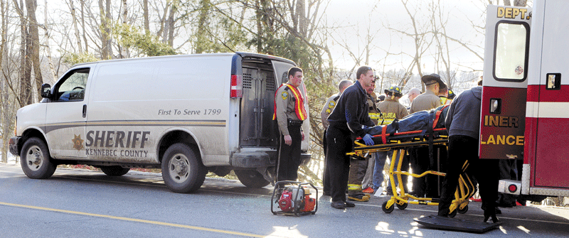 CHELSEA CRASH: Gardiner Rescue and Kennebec County Sheriff's deputies work at the scene of a collision between a Sheriff's Department prisoner transport van and a car on Wednesday afternoon in Chelsea. The collision occurred around 3:30 p.m. near the intersection of Route 9 and Cheney Road.