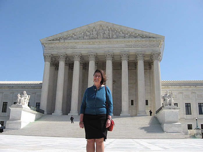 State Rep. Sharon Anglin Treat, D-Hallowell, stands in front of the Supreme Court today.