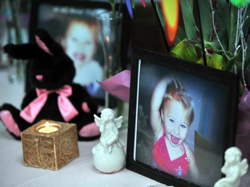 IN FAIRFIELD: A small shrine with pictures and teddy bears honoring missing toddler Ayla Reynolds at a gathering in honor of her at VFW Post 6924 on Saturday.