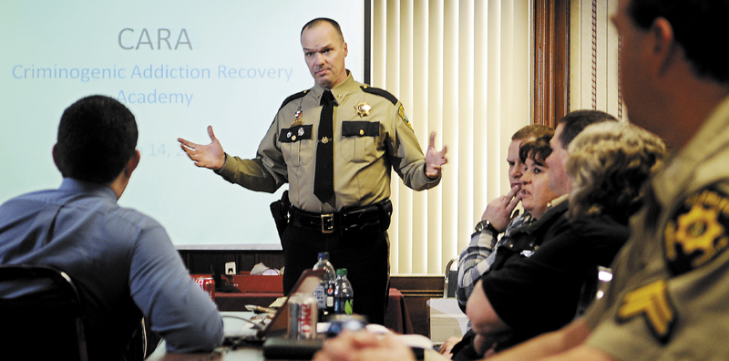 Kennebec County Sheriff Randy Liberty addresses corrections officers from across Maine Wednesday, explaining the rehabilitation program that the jail in Augusta administers. The Criminogenic Addiction Recovery Academy, known as CARA, helps inmates achieve sobriety and refrain from criminal conduct, Liberty said, and may serve as a model for jails across Maine.