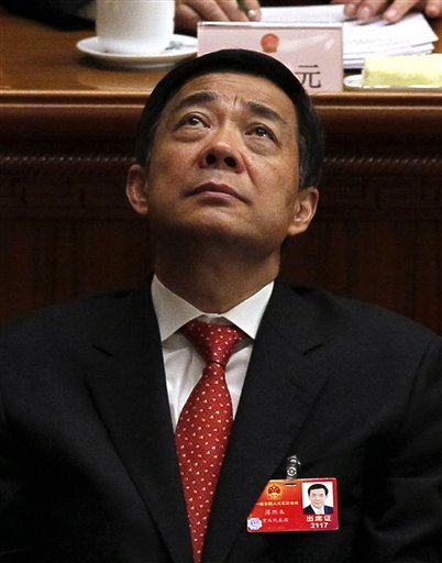 In this March 14, 2012 photo, Bo Xilai, secretary of the Chongqing party, attends the closing session of the annual National People's Congress in the Great Hall of the People, in Beijing, China. China said late Tuesday, April 10, 2012, the ousted high-profile leader Bo, once a contender for a seat in the top leadership, has been suspended from key Communist Party positions in the latest development in the country's biggest political crisis in years. Bo was dismissed as Communist Party boss of the mega-city of Chongqing on March 15 shortly after his former police chief fled temporarily to a U.S. consulate, apparently to seek asylum. (AP Photo/Ng Han Guan, File)