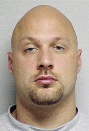 This undated booking mug provided by the Portsmouth Police Department via the Portsmouth Herald shows Cullen Mutrie, suspected of killing Greenland, N.H., Police Chief Michael Maloney and wounding four other officers Thursday, April 12, 2012, before he was found dead along with a female acquaintance early Friday morning. (AP Photo/Portsmouth Police Department via Portsmouth Herald)