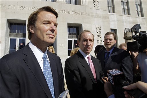 Former presidential candidate John Edwards, left, speaks to the media with attorney Abbe Lowell, right, as he leaves the federal court in Greensboro, N.C., in this Oct. 27, 2011, photo.