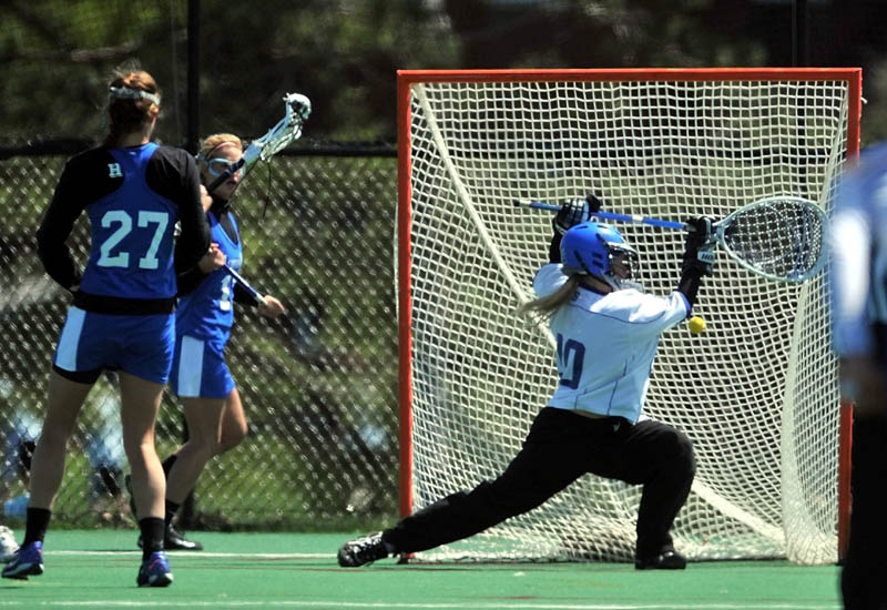 TOUGH DAY: Coby College goalie Michelle Burt, right, misses a shot against Hamilton College in the first round of the New England Small College Athletic Conference women’s lacrosse playoffs Saturday at Colby College in Waterville.