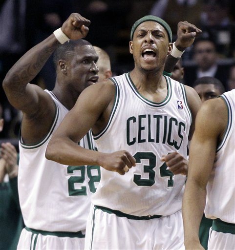 Boston Celtics forwards Paul Pierce (34) and Mickael Pietrus (28) celebrate in the last seconds of overtime against the Atlanta Hawks in an NBA basketball game in Boston Wednesday, April 11, 2012. The Celtics won 88-86. (AP Photo/Elise Amendola)
