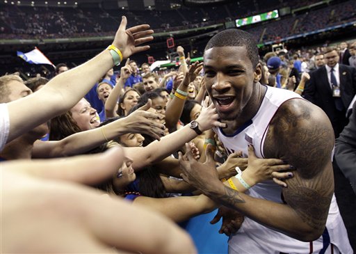 Kansas forward Thomas Robinson celebrates with fans after their 64-62 win over Ohio State during an NCAA Final Four semifinal college basketball tournament game Saturday, March 31, 2012, in New Orleans. (AP Photo/David J. Phillip)