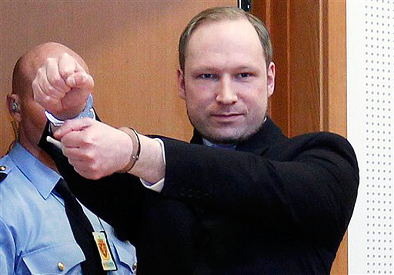 In this Feb. 6, 2012 file photo, Anders Behring Breivik, a right-wing extremist who confessed to a bombing and mass shooting that killed 77 people on July 22, 2011, gestures as he arrives for a detention hearing at a court in Oslo, Norway. Breivik is not criminally insane, a psychiatric assessment found Tuesday, April 10, 2012 contradicting an earlier assessment. The new conclusion comes just six days before Breivik is scheduled to go on trial on terror charges for the massacre on July 22. (AP Photo/Heiko Junge, Scanpix Norway) BNC