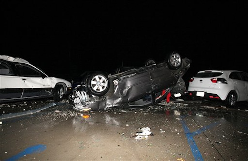 A powerful storm raked across Creston, Iowa, over the night on Saturday, April 14, 2012, leaving a wake of overturned cars, downed power lines, property damage to homes, the hospital and Southwestern Community College. (AP Photo/Bryon Houlgrave, The Register)