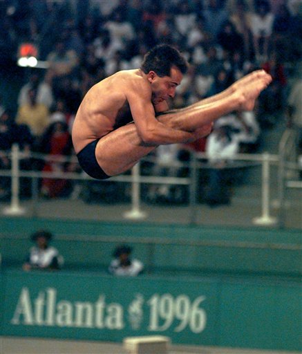 Mark Lenzi competes in the preliminaries of the Olympic men's 3-meter springboard competition in this 1996 photo.