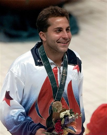 A July 29, 1996, photo of Mark Lenzi, winning an Olympic bronze medal in the men's 3-meter springboard competition.