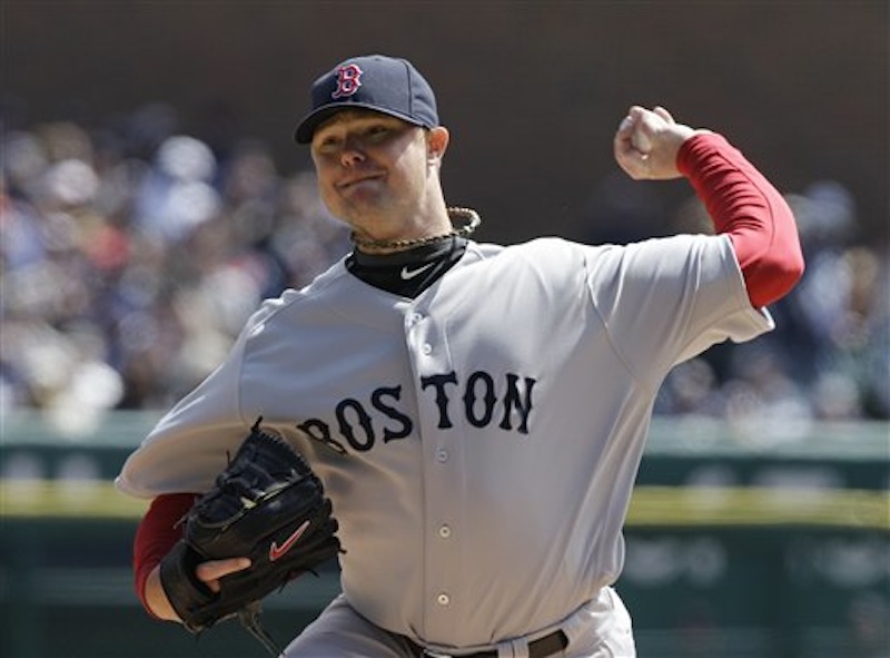 Boston Red Sox starting pitcher Jon Lester (31) throws during the second inning of a baseball game against the Detroit Tigers in Detroit, Thursday, April 5, 2012. Lester went seven innings and only allowed one run, but the Sox lost 3-2. (AP Photo/Carlos Osorio)
