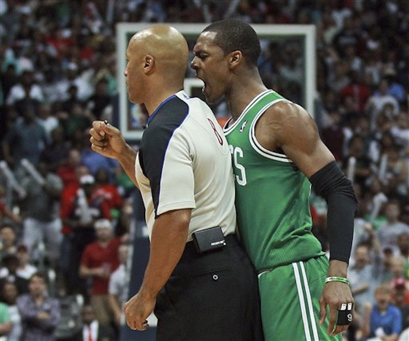 Boston Celtics guard Rajon Rondo bumps referee Marc Davis late in the fourth quarter of Game 1 of a first-round NBA basketball playoff series between the Celtics and the Atlanta Hawks on Sunday, April 29, 2012, in Atlanta. Rondo was ejected. The Hawks won 83-74. (AP Photo/Boston Herald, Matthew West) BOSTON GLOBE OUT, METRO BOSTON OUT, MAGS OUT, ONLINE OUT