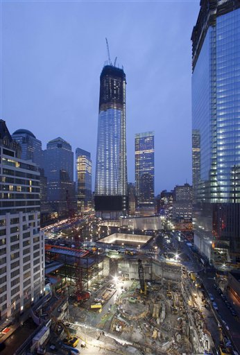 1 World Trade Center, center, now up to the 100th floor, and Four World Trade Center, right, overlook the ongoing construction of the site in New York.