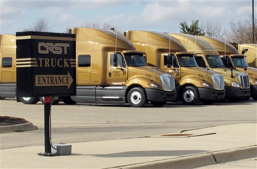 Trucks parked outside the headquarters of CRST Van Expedited, Inc., in Cedar Rapids, Iowa, where dozens of female employees say they experienced aggressive sexual harassment by male drivers during training rides.