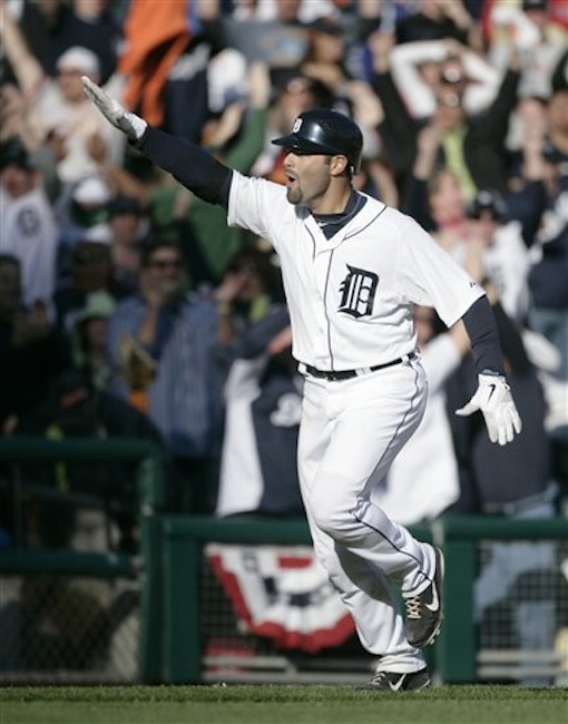 Detroit Tigers' Alex Avila celebrates his two-run walk-off home run that gave the Tigers a 13-12 win over the Boston Red Sox in the 11th inning of a baseball game Sunday, April 8, 2012, in Detroit. (AP Photo/Duane Burleson)