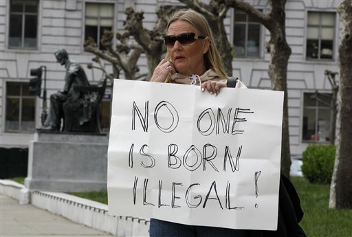 Tuulia Lowe protests against immigration deportations Wednesday in San Francisco. Supreme Court justices strongly suggested Wednesday that they are ready to allow Arizona to enforce part of a controversial state law requiring police officers to check the immigration status of people they think are in the country illegally.