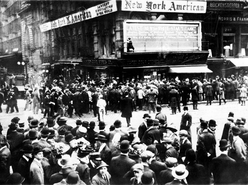 HUGE STORY: In this April 1912 file photo, crowds gather around the bulletin board of the New York American newspaper in New York, where the names of people rescued from the sinking Titanic are displayed. It was a news story that would change the news. From the moment that a brief Associated Press dispatch relayed the wireless distress call _ "Titanic ... reported having struck an iceberg. The steamer said that immediate assistance was required" _ reporters and editors scrambled. In ways that seem familiar today, they adapted a dawning newsgathering technology and organized saturation coverage and managed to cover what one authority calls "the first really, truly international news event where anyone anywhere in the world could pick up a newspaper and read about it." Today marks the 100th anniversary of the luxury liner's sinking.