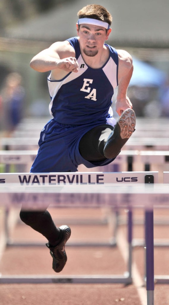 UP AND OVER: Erskine Academy Zach Lee competes in the hurdle shuttle Thursday during the David Whyte Memorial Relays at Drummond Field in Waterville.
