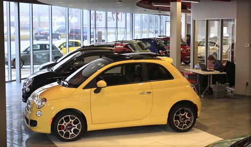 Fiat 500 vehicles are displayed at the Golling Fiat dealership in Birmingham, Mich. The Chrysler Group says its U.S. sales jumped 34 percent in March on strong sales of Fiat small cars and Chrysler sedans.