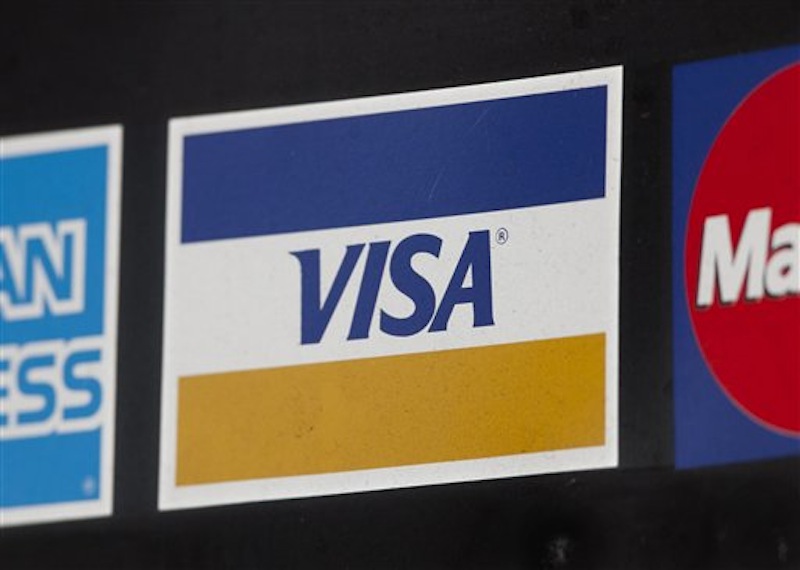 In this photo of March 19, 2012, a sign for Visa is shown in New York. (AP Photo/Mark Lennihan) CREDIT CARD DEBIT CARD