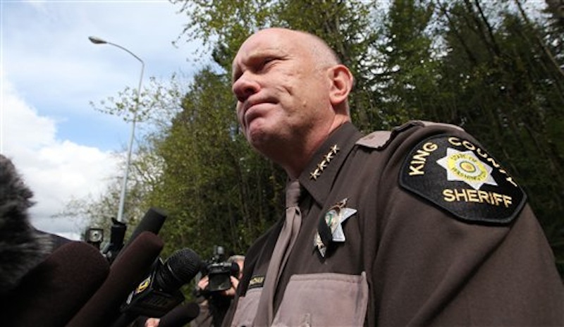 King County Sheriff Steve Strachan speaks with media members about police finding the bunker of man suspected of killing his wife and daughter days earlier, Friday, April 27, 2012, in North Bend, Wash. King County deputies say there's someone inside the deep woods bunker of the gun-toting survivalist suspected of the killings and holing up for days in the Cascade foothills east of Seattle. The underground bunker is surrounded by police, who have pumped gas inside. Sgt. Cindi West says photos found in Peter A. Keller's home helped them find the bunker Friday morning. (AP Photo/Elaine Thompson)