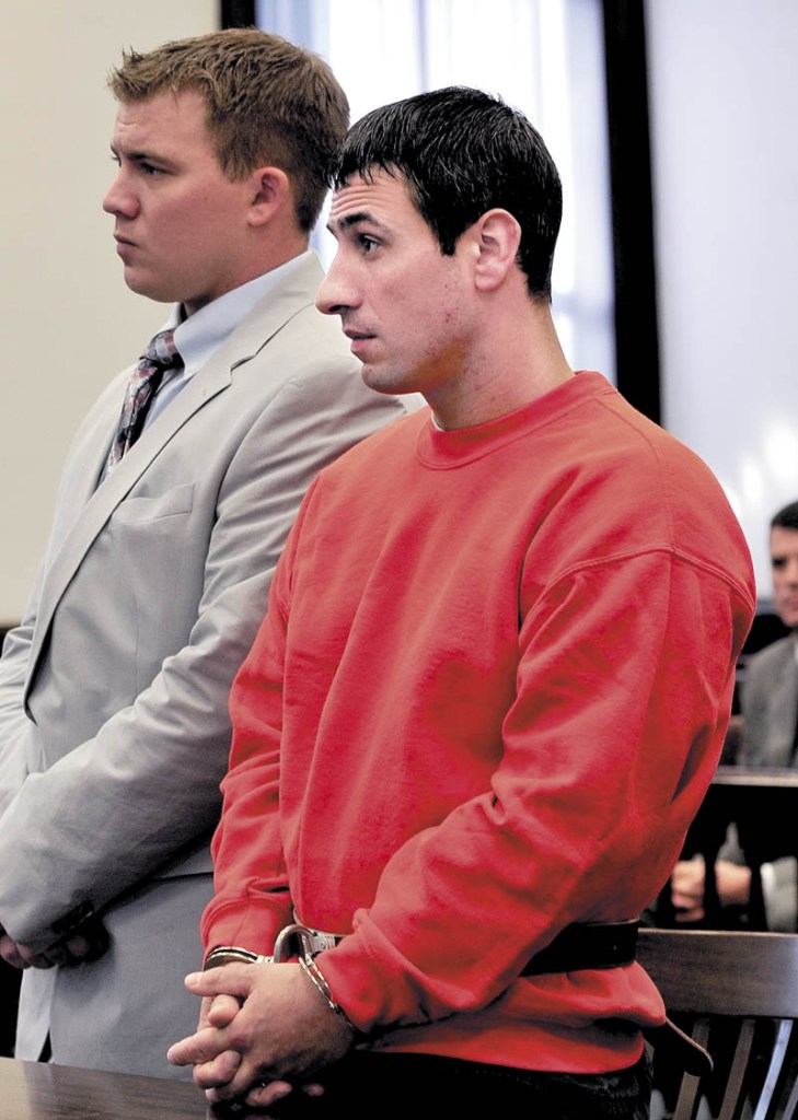 PLEA: Defendant Angelo Licata pleads not guilty in the death of his father Alfred Licata in Somerset Superior Court in Skowhegan last year. Beside Licata is his attorney, Francis Griffin.