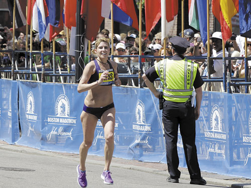 TOP AMERICAN FEMALE: Sheri Piers of Falmouth approaches the finish line of the Boston Marathon on Monday in Boston. Piers was the first American female to finish the race, coming in 10th place overall.