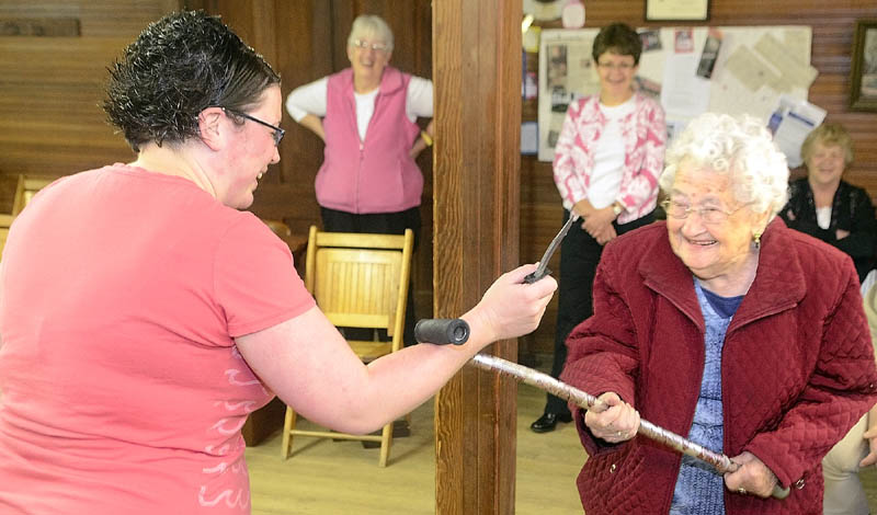 Instructor Karen Jones, owner of Tao Karate Club, is disarmed of her plastic knife by 95-year-old Bea Campbellton during a self-defense demonstration on Saturday morning at the Chlesea Grange.