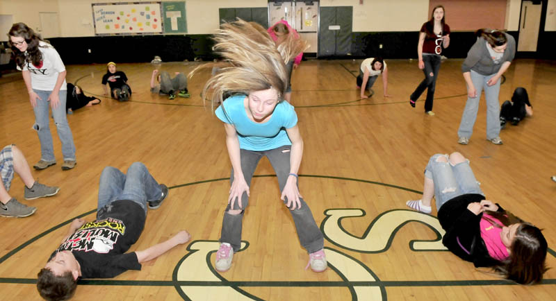 DANCE FEVER: Linda Riley, center, and other Carrabec Community School students rehearse dance routines at the school in North Anson recently.