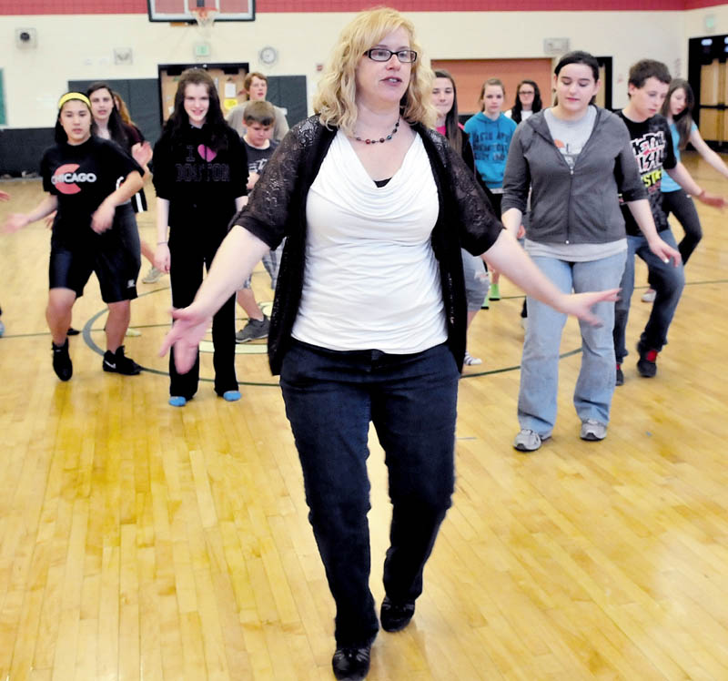 FOLLOW MY LEAD: Maine Dance Institute Director Jill Everett leads Carrabec Community School students in dance rehearsal recently.