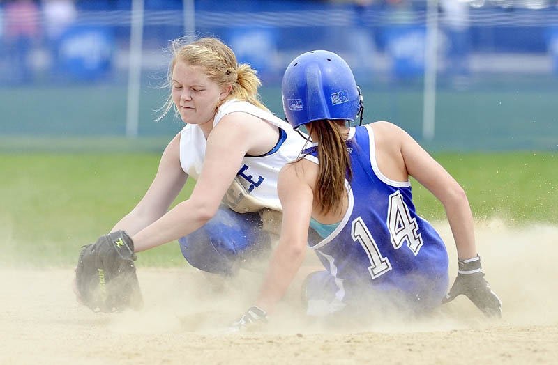 Staff photo by Joe Phelan Erskine Academy baserunner Avery Bond , right, slides safely into second base before Lawrence shortstop Alli Dyer, left, can apply the tag during a game on Friday in China.