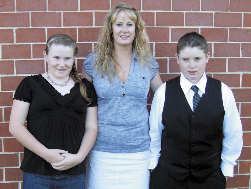 THE VICTIMS: Amy Bagley Lake, with her children, Monica and Coty, in June. The three were shot and killed June 13 at their home in Dexter by Steven Lake. In the year before their deaths, Amy Lake and her children lived in at least seven locations as they tried to avoid Steven Lake. A protection from abuse order was issued, though he allegedly violated it in Harmony in November 2010.