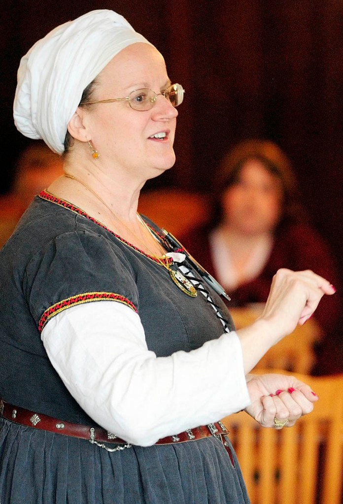 Mistress Suzanne Neuber de Londres teaches a class during The East Kingdom Brewers' Collegium event sponsored by the Society for Creative Anachronism on Saturday at the River Back Dance Club in Augusta.
