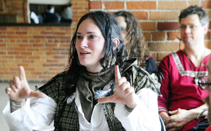 Shannon Esslinger asks a question during The East Kingdom Brewers' Collegium event sponsored by the Society for Creative Anachronism on Saturday at the River Back Dance Club in Augusta.