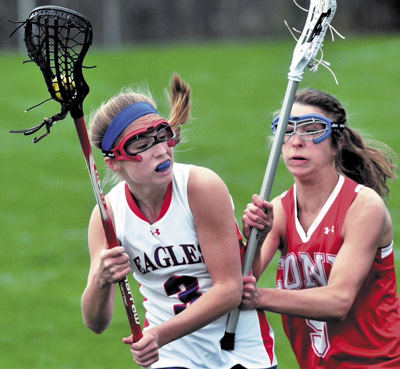 BATTLE IS ON: Cony’s Josie Lee, right, defends Messalonskee Sara Gernier during the Rams’ 11-10 win Thursday in Messalonskee.
