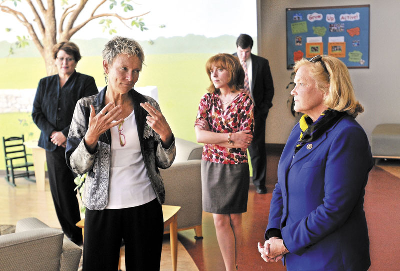 TOUR: Waterville mayor Karen Heck, left, talks to U.S. Rep. Chellie Pingree, D-1st District, right, during a tour of Educare Central Maine on Wednesday. Seen in the background is Kathy Colfer, left, director of Child and Family Services at KVCAP, and Lauren Sterling, center, philanthropy specialist for Educare Central Maine.