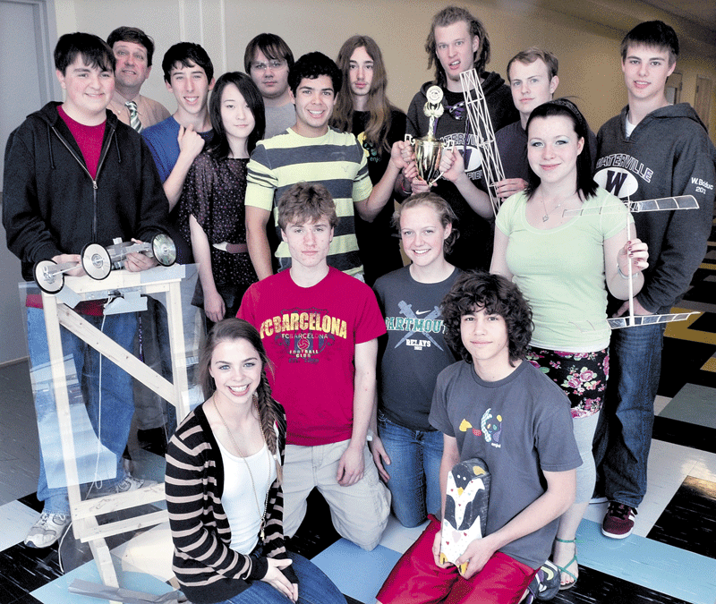 THE WINNERS: Members of the Waterville Senior High School Science Olympiad team hold trophies and items used in recent competition. From left in back row are, Zachary Caruso, teacher Jon Ramgren, Ryan Tozier, Allie Wu, Ben Congdon-Jones, Adrian Rivas, Anthony Bellavia, Darien Acero, Callum Thomas and Will Bolduc. In front are Georgia Bolduc, John Terhune, Phoebe Downer, Joseph Bellavia and Mollie Pleau.