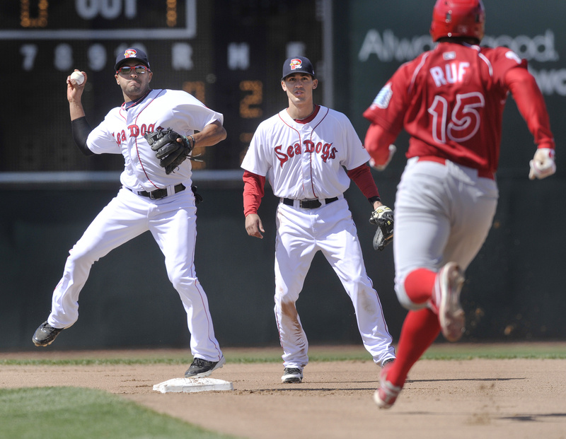 Sea Dogs second baseman Ryan Dent forces out Reading’s Darin Ruf before throwing to first base to complete a double play during Portland’s 9-1 win at Hadlock Field.