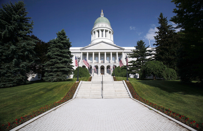 In this June 9, 2011 photo, the State House is seen in Augusta, Maine. The Maine House passed a bill Thursday that would lower the state income tax to 4 percent. (AP Photo/Robert F. Bukaty)