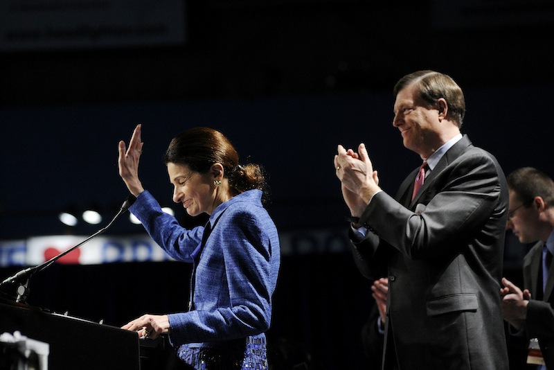 Sen. Olympia Snowe acknowledges the delegates after her speech at the Maine Republican Party State Convention on Sunday. Looking on is her husband, former Maine Gov. John McKernan.