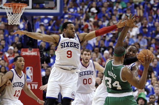 Boston Celtics' Paul Pierce (34) looks to pass as Philadelphia 76ers' Elton Brand, Spencer Hawes, Andre Iguodala and Evan Turner, from right, defend during the second half of Game 6 of an NBA basketball Eastern Conference semifinal playoff series, Wednesday, May 23, 2012, in Philadelphia. Philadelphia won 82-75. (AP Photo/Matt Slocum)