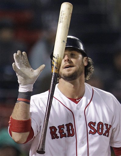 Boston Red Sox's Jarrod Saltalamacchia tosses his bat after he was called out on strikes during the ninth inning of a baseball game against the Oakland Athletics at Fenway Park in Boston, Tuesday, May 1, 2012. The Athletics won 5-3. (AP Photo/Elise Amendola)