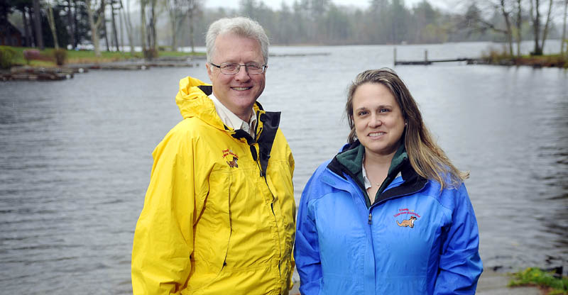 Former car dealer John Blouin, left, is the new executive director of the Friends of the Cobbossee Watershed, while longtime employee Tamara Whitmore has been promoted to education and programs director of the group. Whitmore and Blouin, seen at the Manchester boat landing on Lake Cobbosseecontee last week, will head a nonprofit group that aims to educate residents of the watershed and improve water quality.