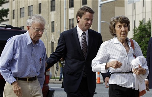 John Edwards, center, his mother Bobbie Edwards, right, and his father Wallace Edwards, left, arrive at the federal courthouse in Greensboro, N.C., today.