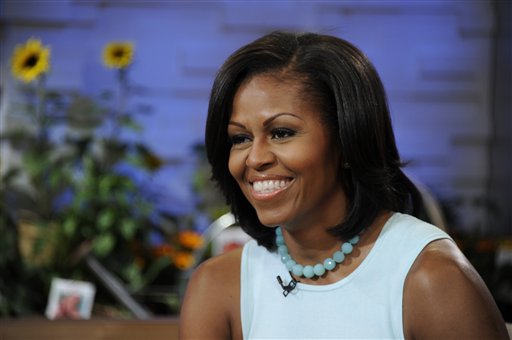 This image released by ABC shows first lady Michelle Obama on the morning program "Good Morning America," Tuesday, May 29, 2012 in New York. Obama discussed a variety of topics including her new book "American Grown: The Story of the White House Kitchen Garden and Gardens Across America," which promotes healthy eating. (AP Photo/ABC, Ida Mae Astute) GM12