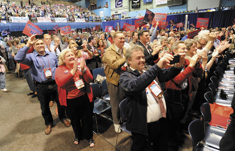 Delegates cheer for Governor Paul LePage as he is introduced to speak during the Maine Republican Party State Convention Sunday,