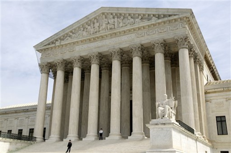In this March 28, 2012 file photo, the Supreme Court is seen in Washington. The Supreme Court ruled Monday twins conceived after their dad's death through artificial insemination are not eligible for his Social Security survivor benefits. (AP Photo/Charles Dharapak, File)