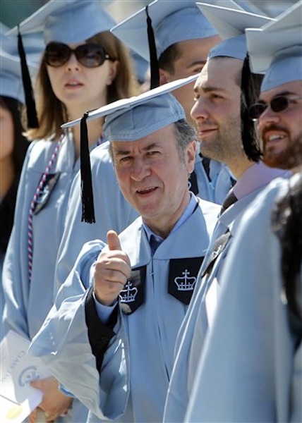 Columbia University janitor Gac Filipaj give a thumbs up during the Columbia University School of General Studies graduation ceremony, Sunday, May 13, 2012, in New York. Filipaj, 52, an ethnic Albanian who left his native Montenegro 20 years ago to escape war, is graduating with honors after 12 years of balancing studies and his full-time job. (AP Photo/Jason DeCrow)