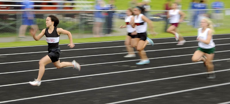 RACE TO THE FRONT: Hall-Dale High School’s Bri Crisci, left, runs in the 100-meter dash during the Mountain Valley Conference track and field meet Friday at Alumni Field in Augusta. Crisci won in a time of 13.29. She also took first place in the 200 and 400.